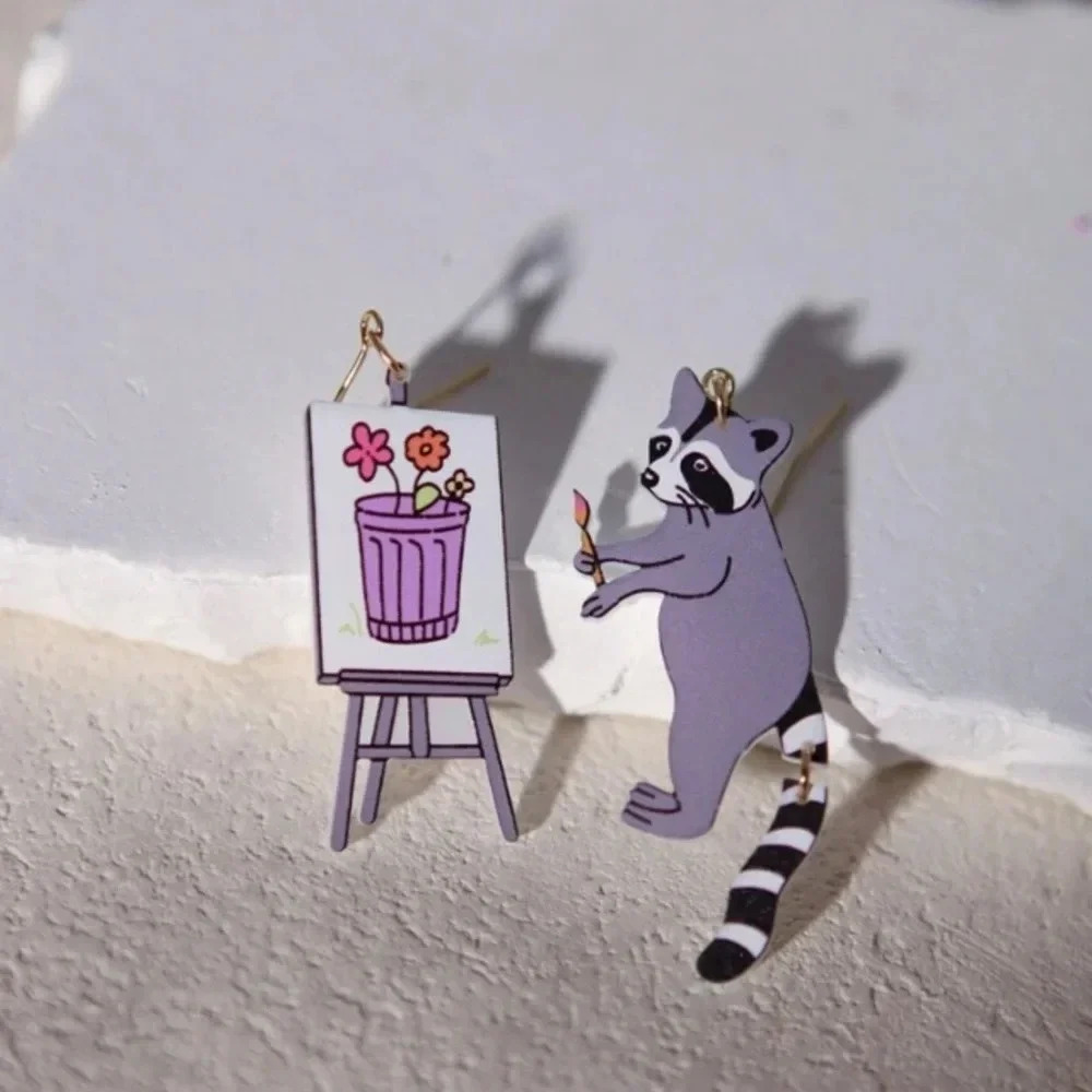 Purple white painting raccoon and art canvas and easel dangle drop earrings fun